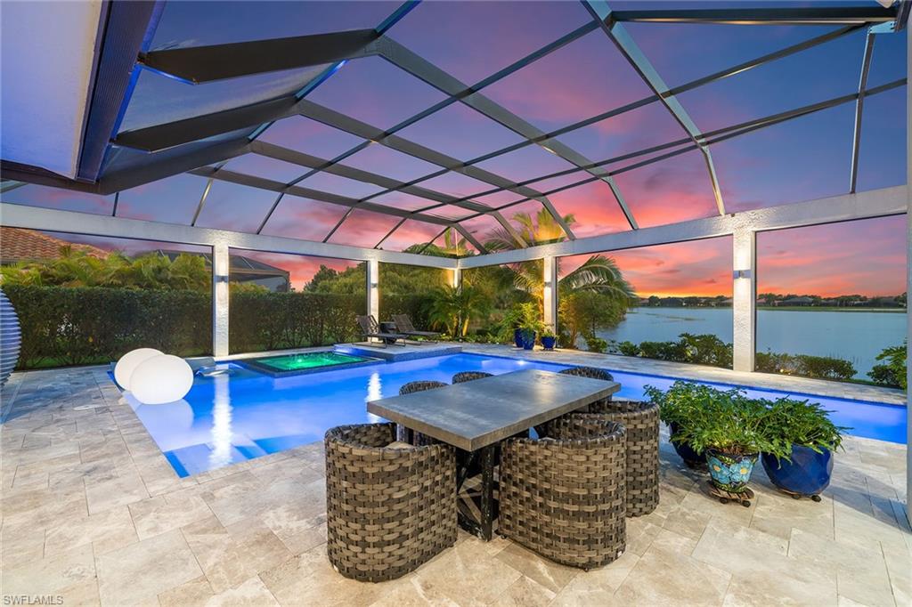 12499 Twin Eagles Boulevard Naples, FL 34120 - Photo 43 of 50 a outdoor space with the couches and dining table with the garden view