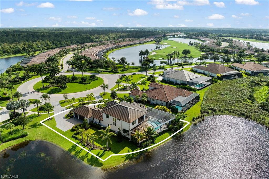 12499 Twin Eagles Boulevard Naples, FL 34120 - Photo 45 of 50 an aerial view of residential houses with outdoor space and river