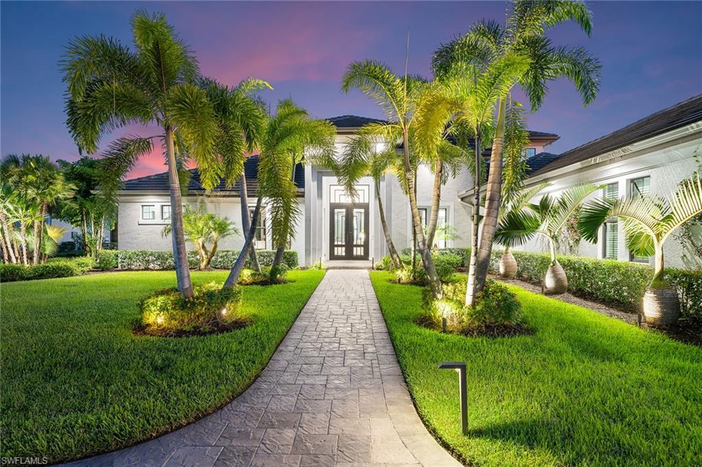 12499 Twin Eagles Boulevard Naples, FL 34120 - Photo 47 of 50 a view of a garden in front of a house