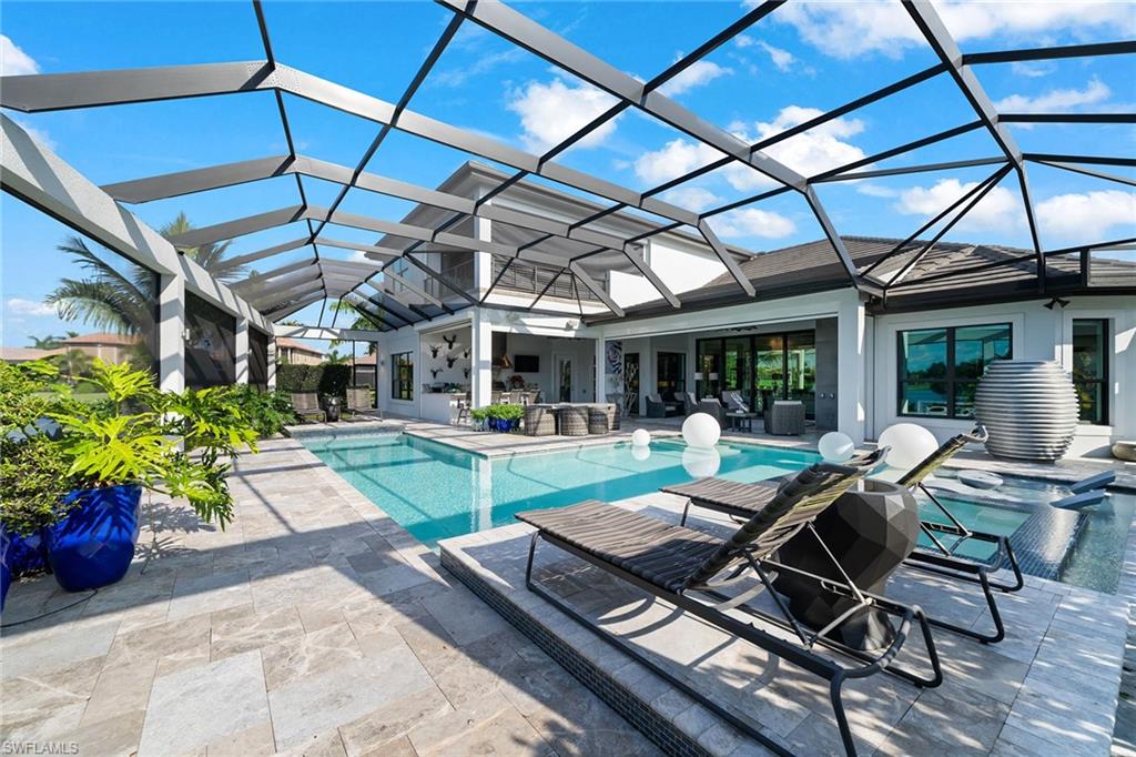 12499 Twin Eagles Boulevard Naples, FL 34120 - Photo 6 of 50 a view of a patio with chairs and a patio