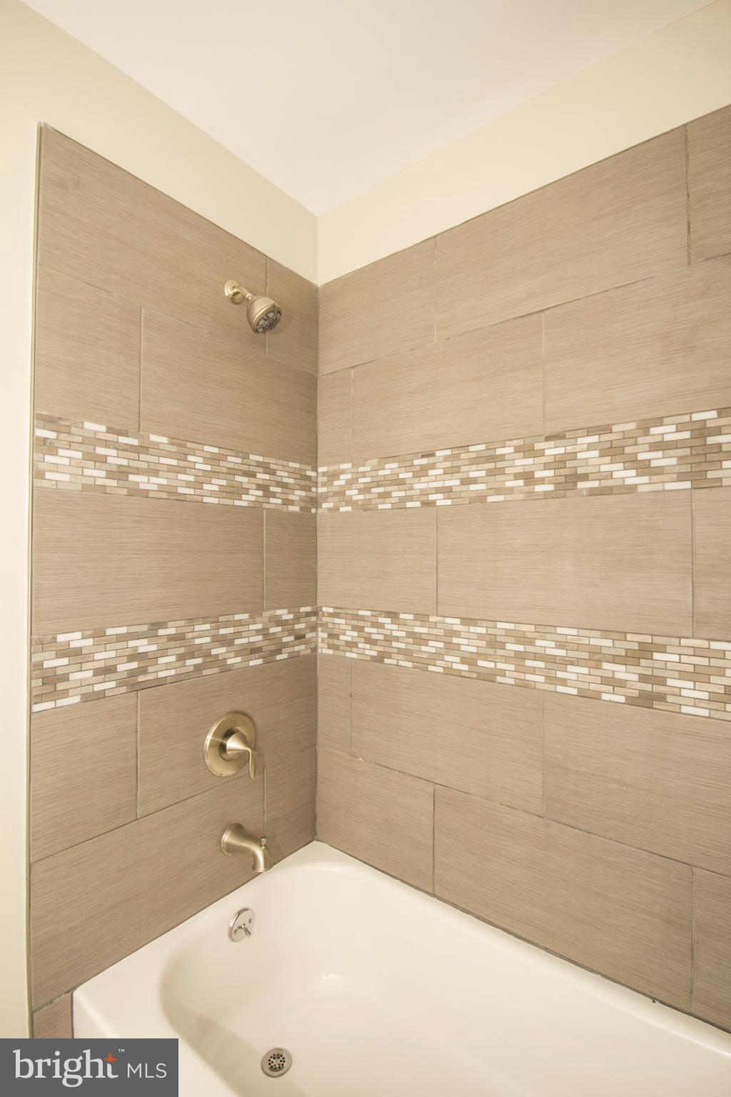 6701 Longhill Road Baltimore, MD 21207 - Photo 10 of 27 a bathroom with a shower