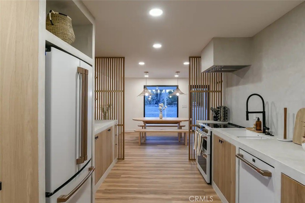 571 Ripon Avenue Yucca Valley, CA 92284 - Photo 21 of 43 a kitchen with stainless steel appliances a refrigerator and a stove