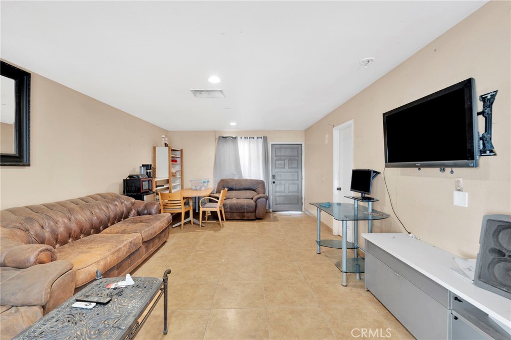 28571 Wild Helendale, CA 92342 - Photo 19 of 22 a living room with furniture and a flat screen tv