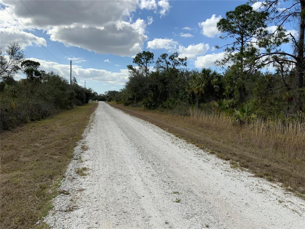 4219 East 30th Street Alva, FL 33920 - Photo 4 of 8 a view of a lake with mountains in the background