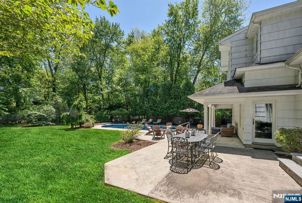 411 Snyder Road Wyckoff, NJ 07481 - Photo 36 of 36 a view of a house with backyard sitting area and garden