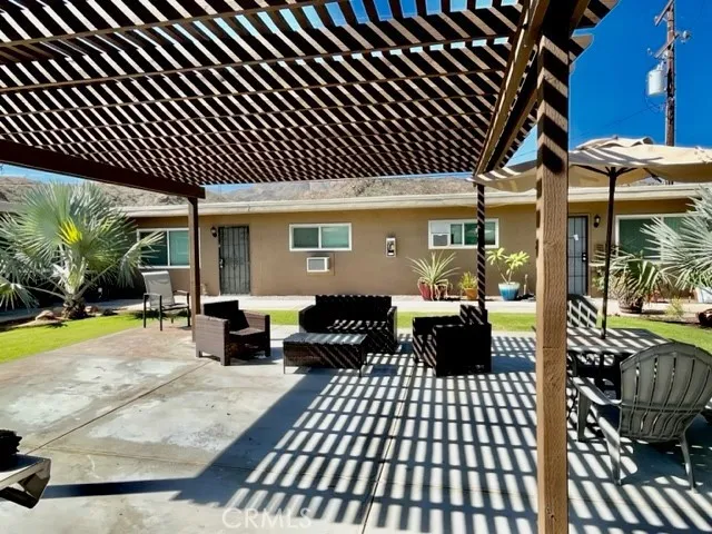 a view of a patio with a table chairs and a patio