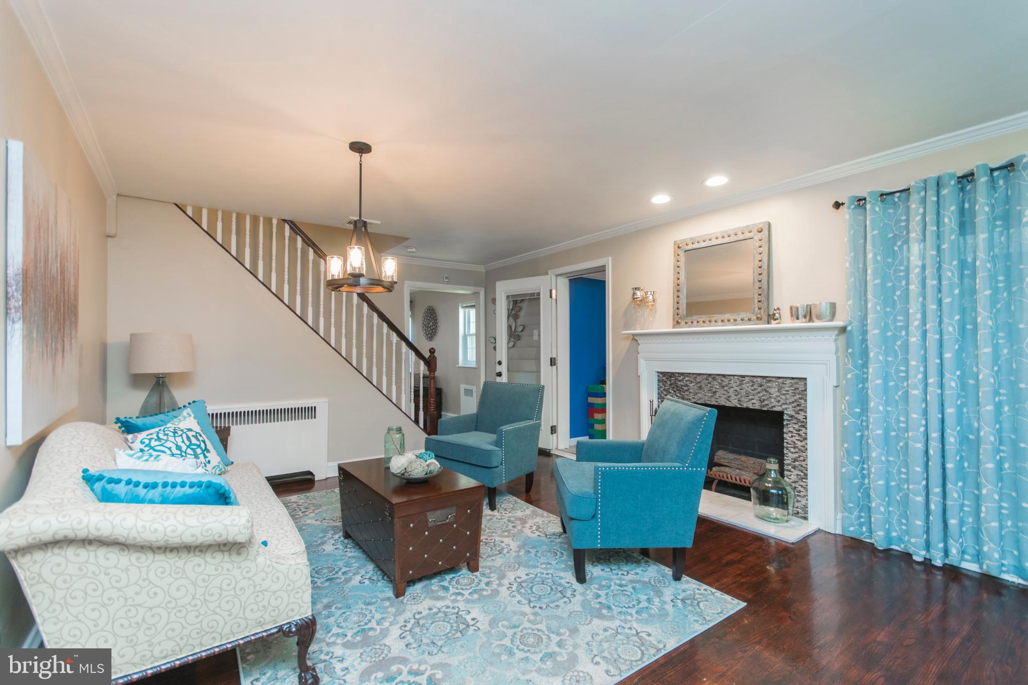 909 Ashbourne Road Cheltenham, PA 19012 - Photo 4 of 36 Living room with wood burning fireplace