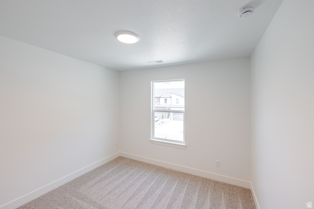 5228 South Acacia Drive, Unit 808 Mapleton, UT 84664 - Photo 18 of 22 Neutral-toned carpeted room with white walls and a single window
