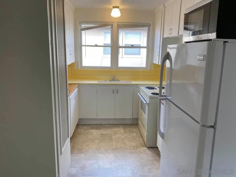 317 Prospect Street La Jolla, CA 92037 - Photo 6 of 24 a view of storage and utility room with a window