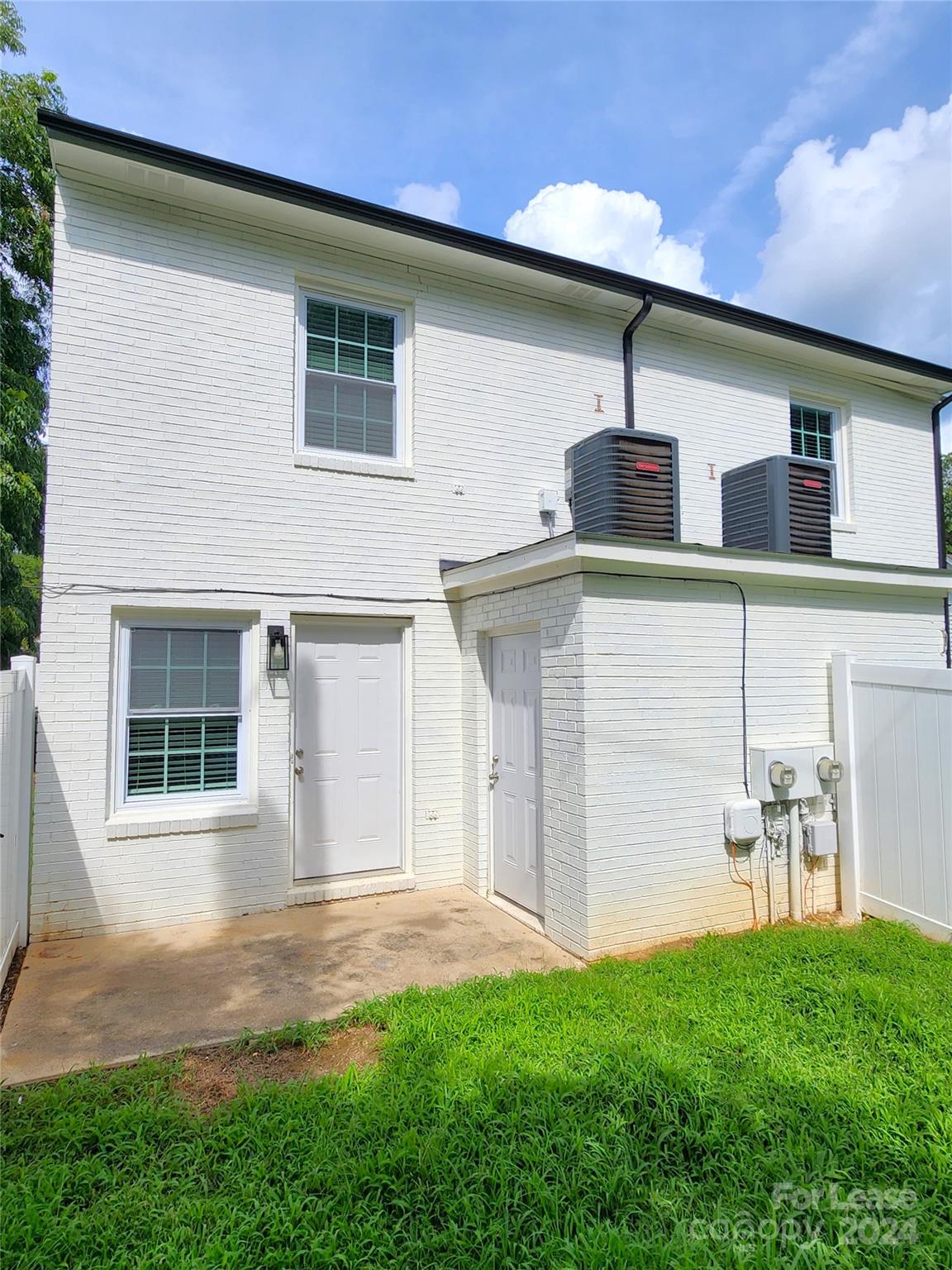 407 Spring Street Northwest, Unit 407 Concord, NC 28025 - Photo 18 of 19 a front view of house with yard