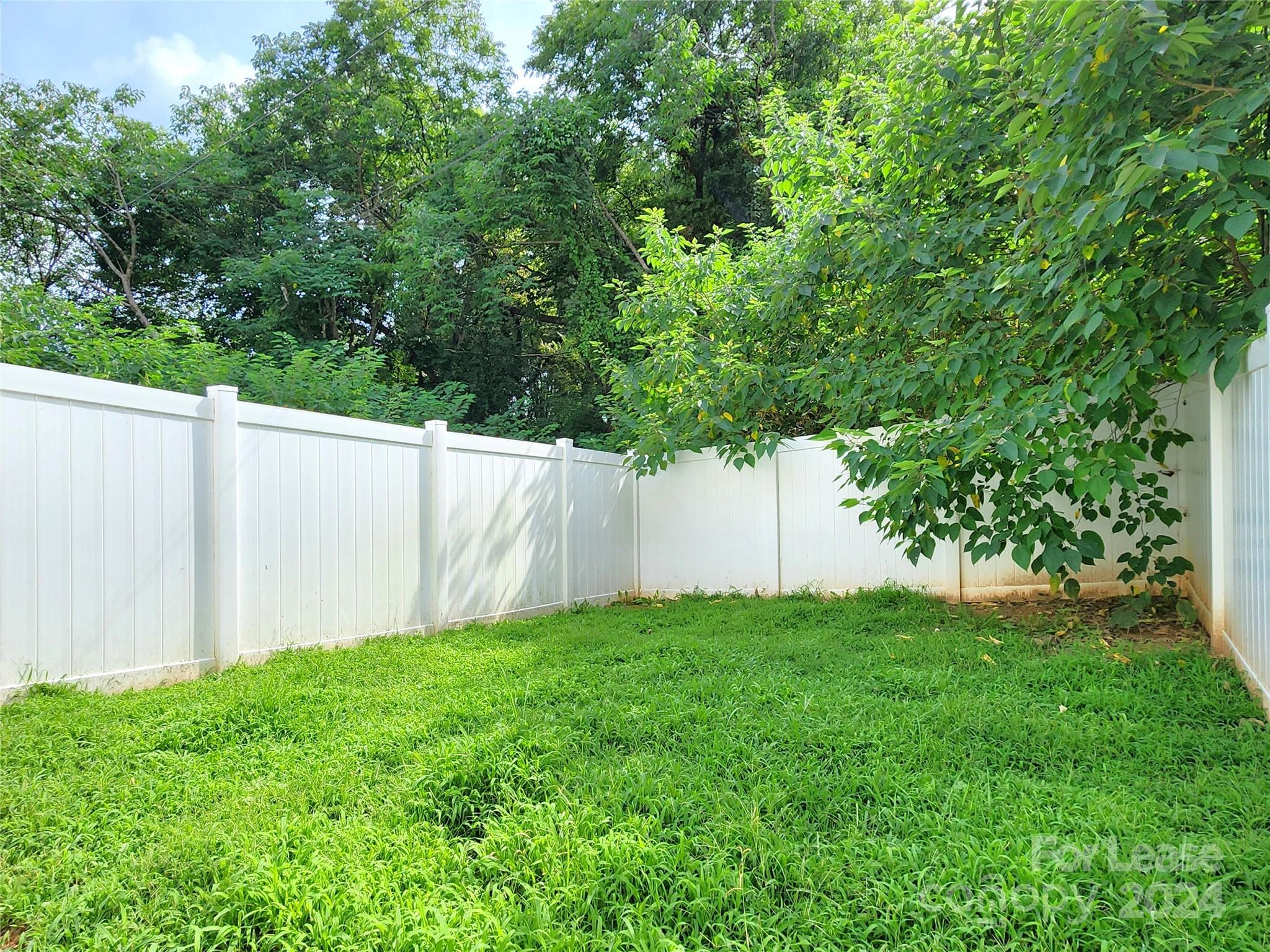 407 Spring Street Northwest, Unit 407 Concord, NC 28025 - Photo 19 of 19 a view of a backyard