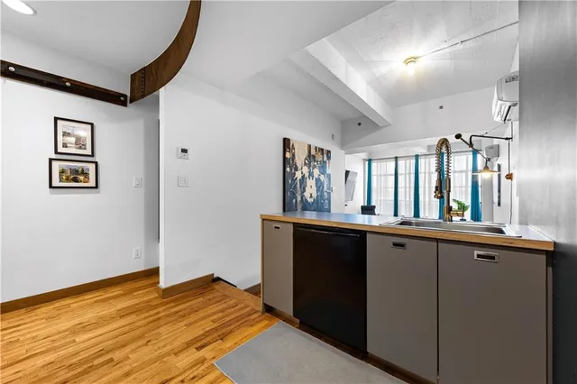 a view of a room with wooden floor and staircase