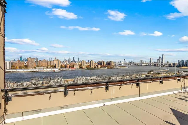 a view of a patio with a table and chairs