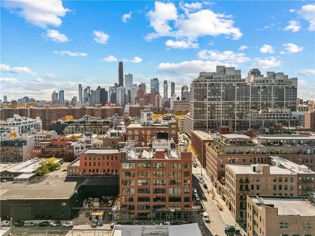 a view of city with tall buildings