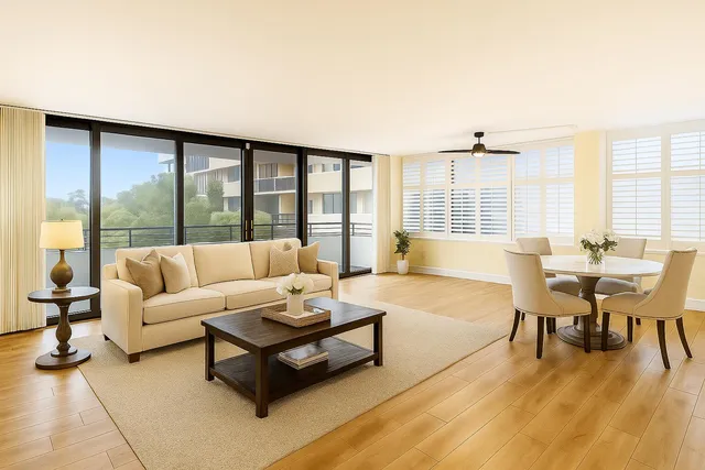 a living room with furniture and a floor to ceiling window
