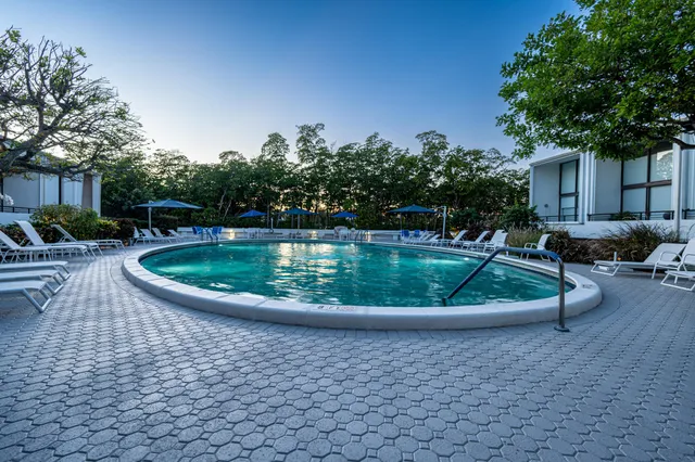 a view of a swimming pool with a patio
