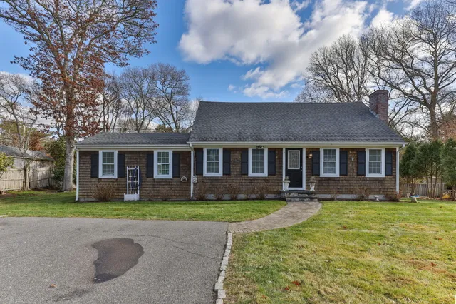 a front view of a house with garden