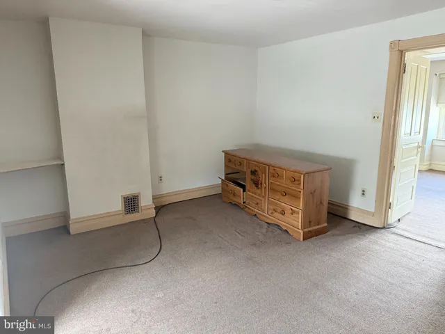 a view of an empty room and window