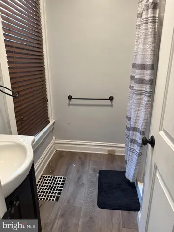 a bathroom with a sink and a shower