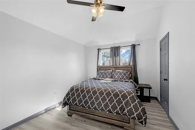 a bedroom with a bed and window