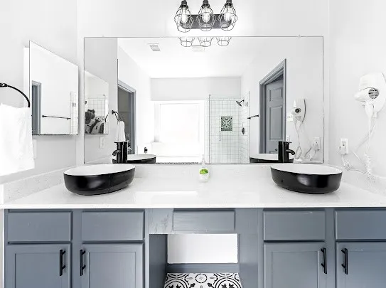 a view of a kitchen counter space a sink and cabinets