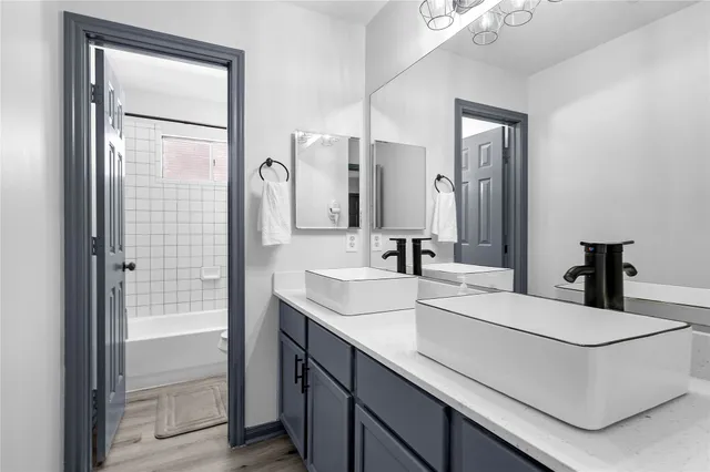 a living room with fireplace furniture and a wooden floor