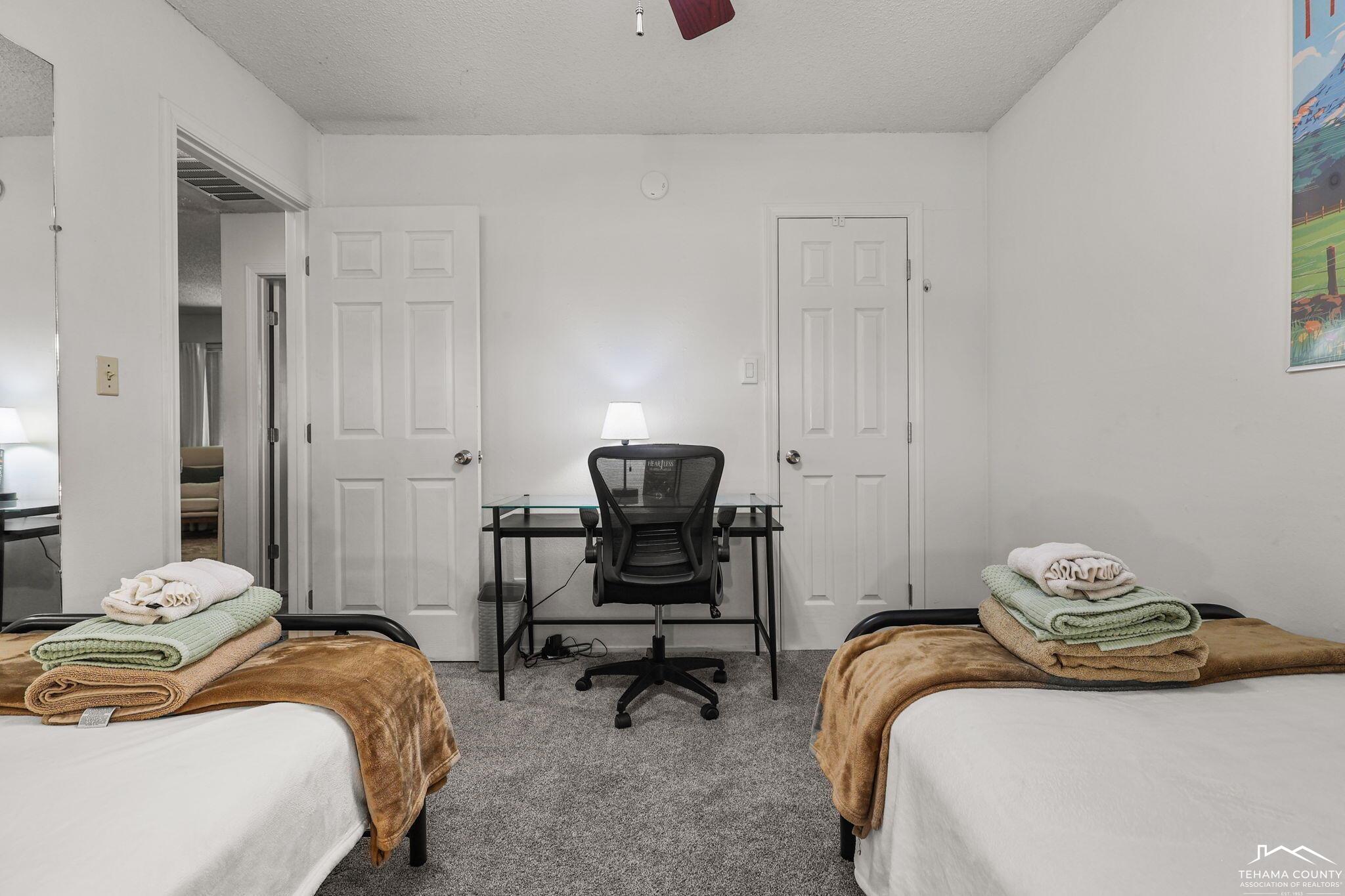 22275 Brent Road Red Bluff, CA 96080 - Photo 22 of 47 a bedroom with a bed and a chair