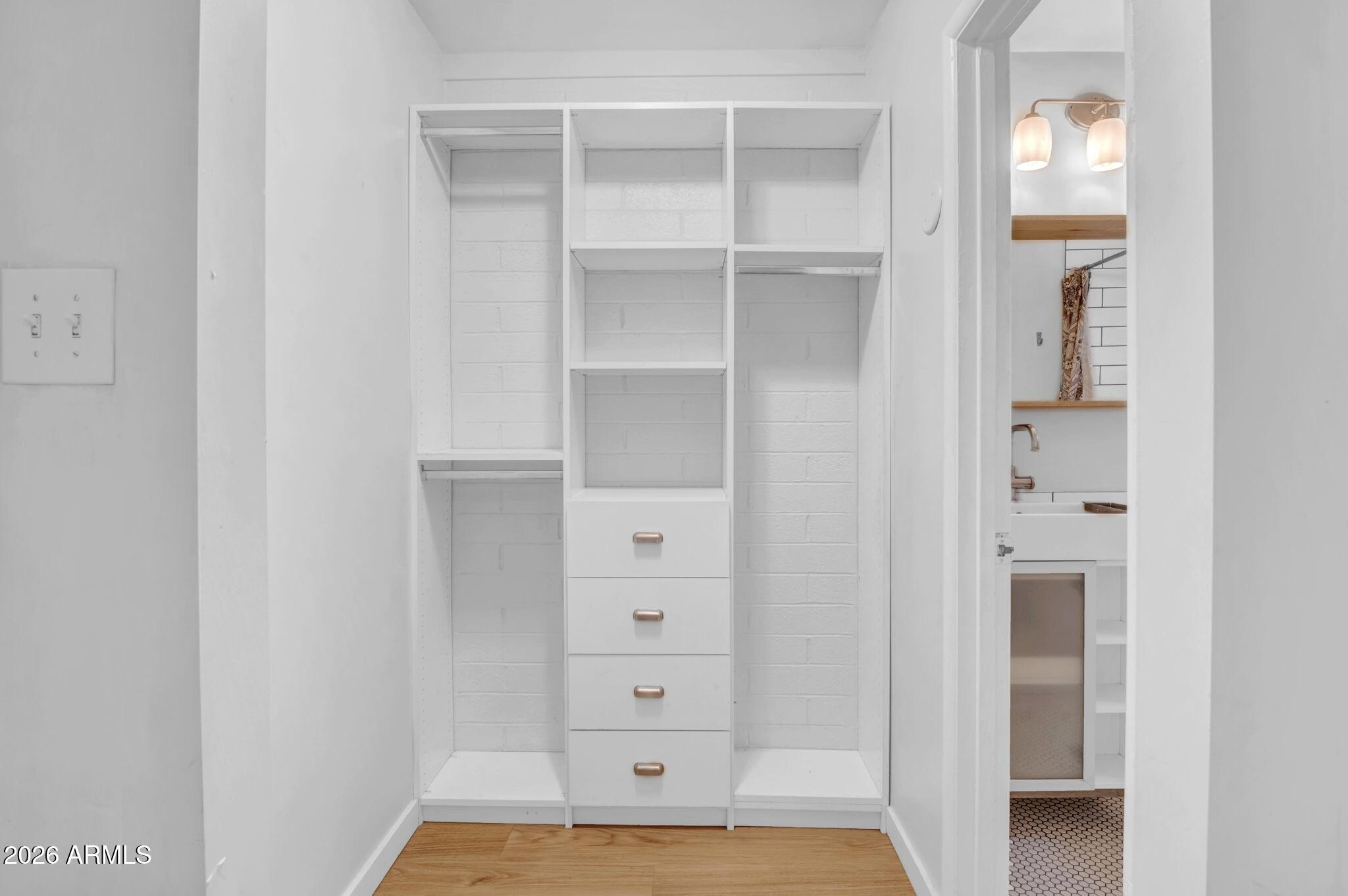 821 North 3rd Street, Unit 8 Phoenix, AZ 85004 - Photo 5 of 10 a view of walk in closet with empty racks