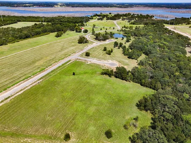 a view of a swimming pool with a yard