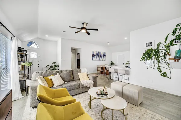 a bedroom with a bed and large window