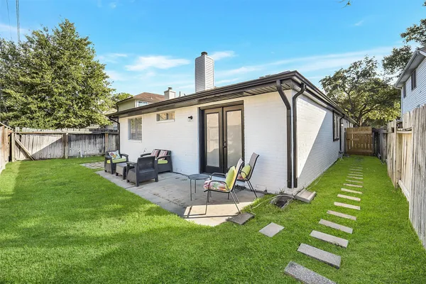 a front view of a house with a garden and porch