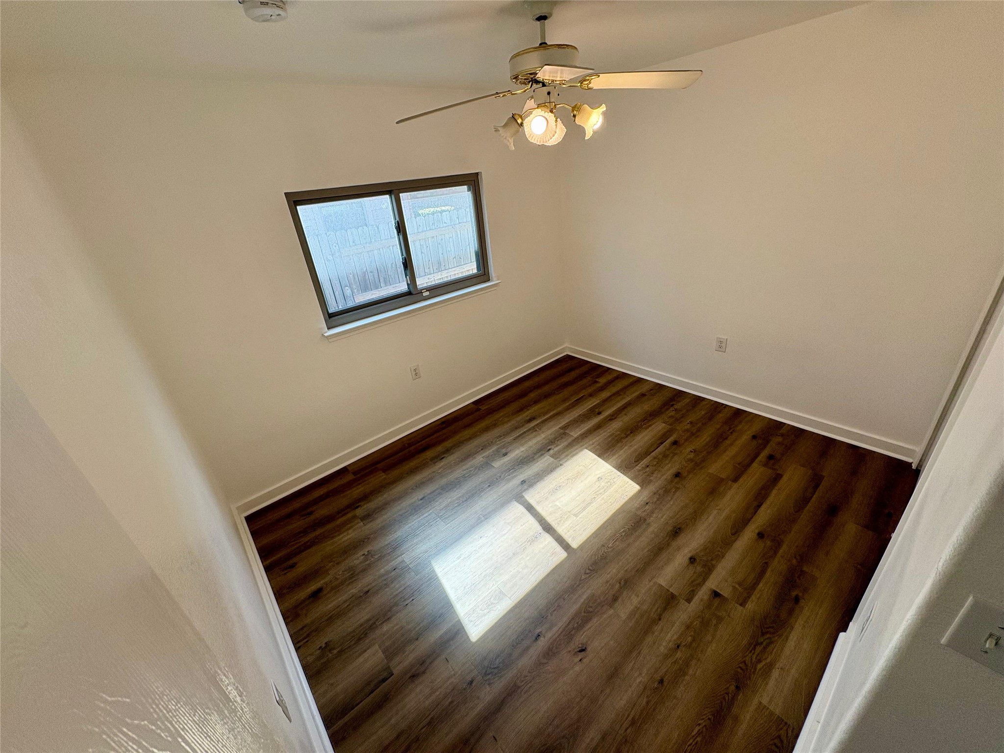 8003 Bannock Lane Austin, TX 78747 - Photo 28 of 40 Bedroom #3 with dark wood finished floors and a ceiling fan