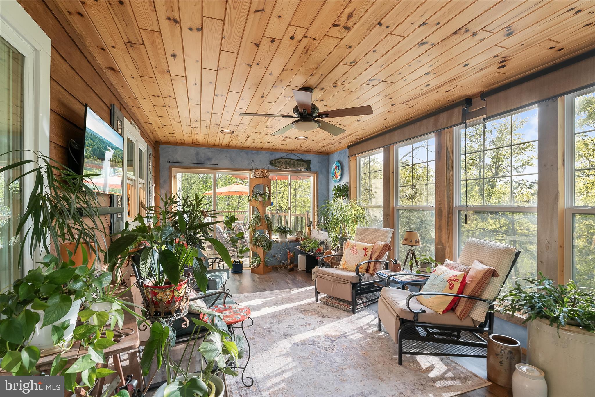 4623 Fishers Hollow Road Myersville, MD 21773 - Photo 21 of 65 a living room with patio furniture and a potted plant