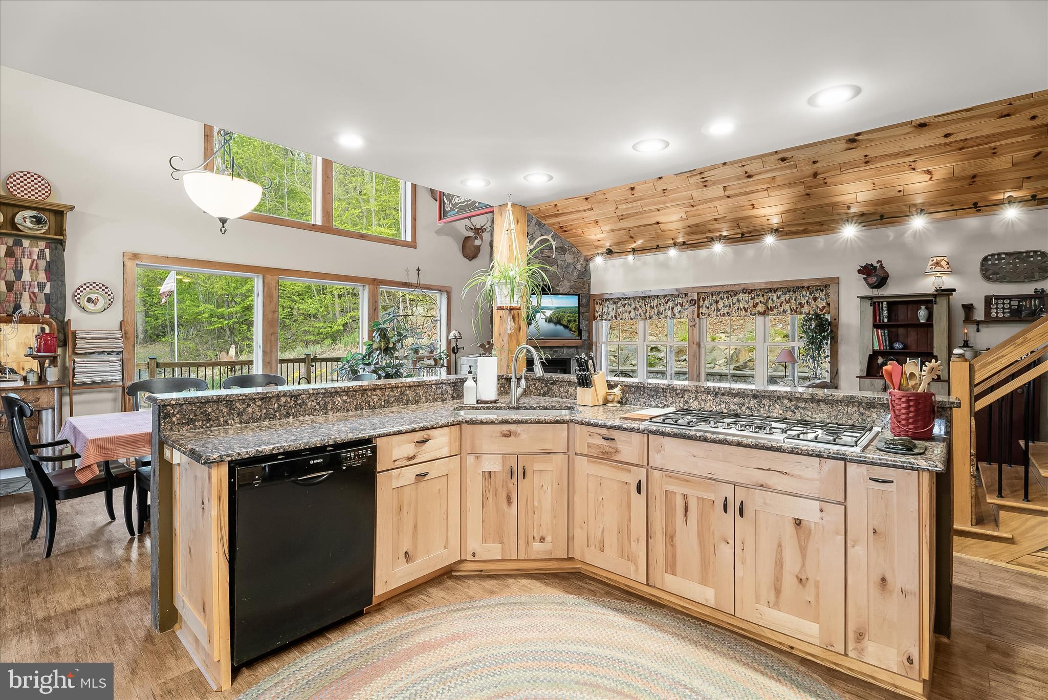 4623 Fishers Hollow Road Myersville, MD 21773 - Photo 29 of 65 a open kitchen with stainless steel appliances granite countertop a stove and cabinets