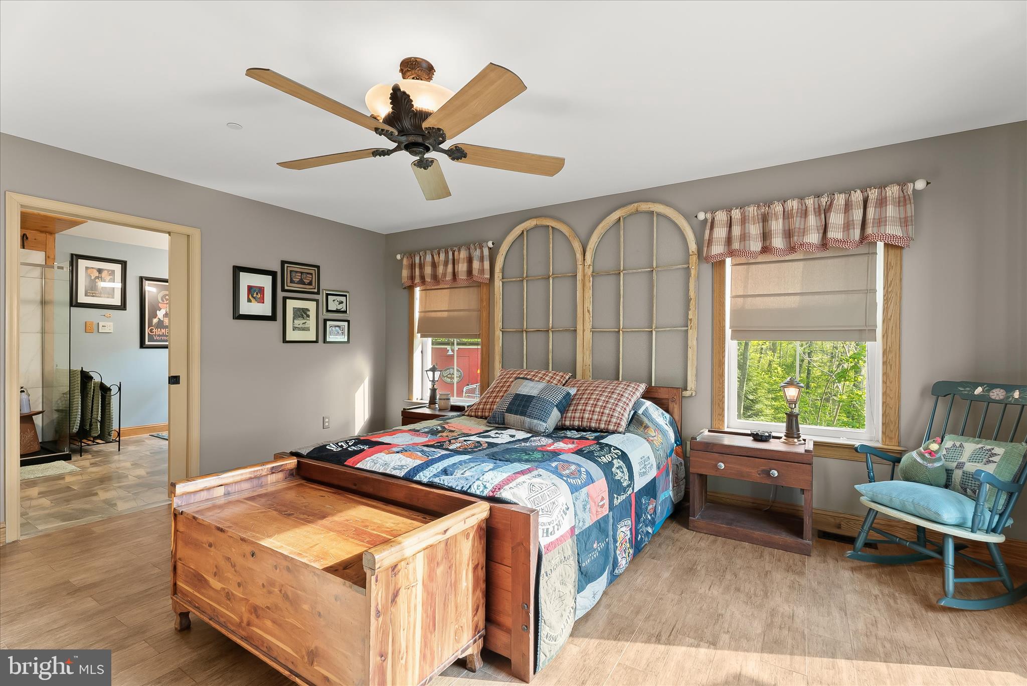 4623 Fishers Hollow Road Myersville, MD 21773 - Photo 36 of 65 a bedroom with a bed and a chandelier