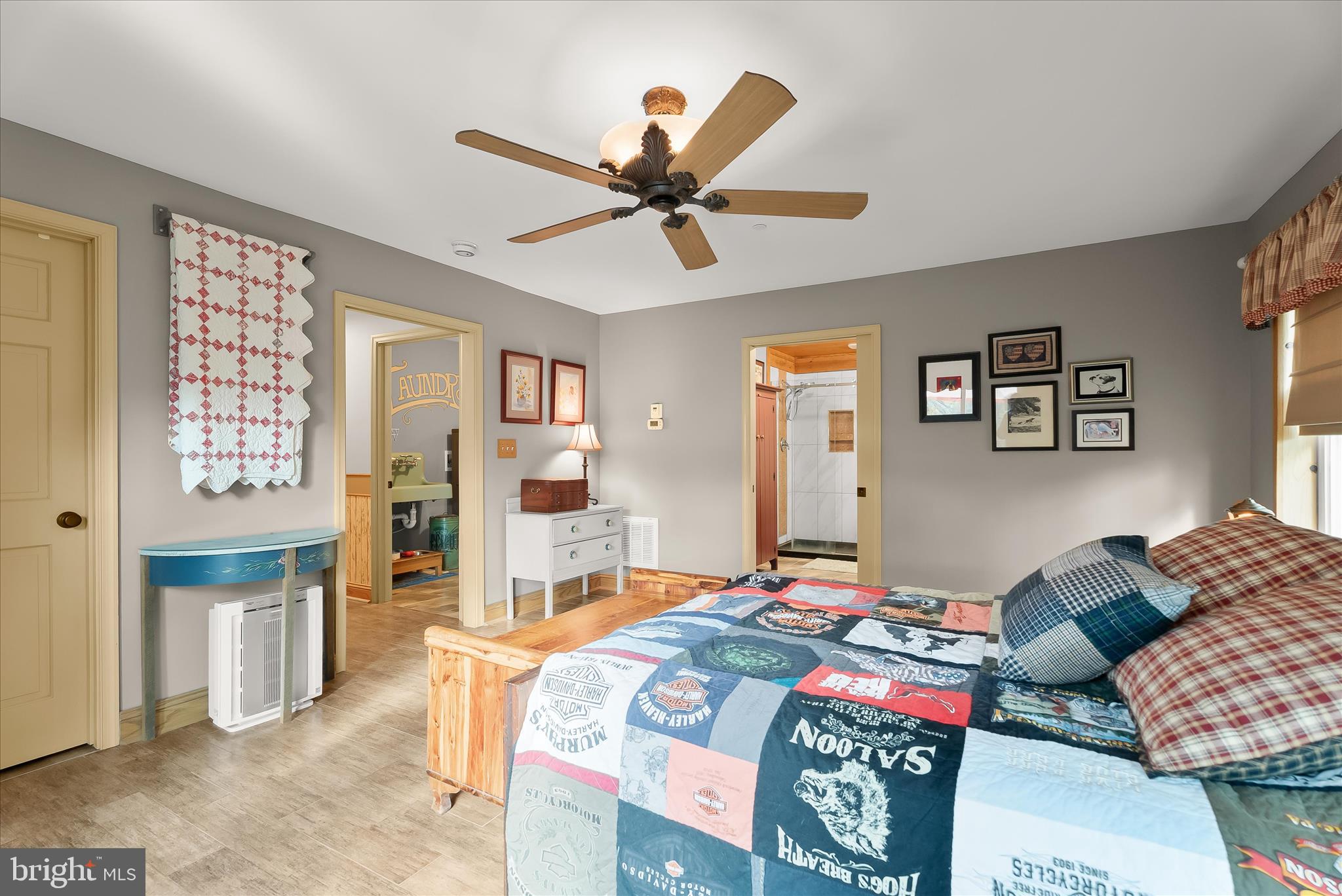 4623 Fishers Hollow Road Myersville, MD 21773 - Photo 37 of 65 a bedroom that has a bed and a chandelier