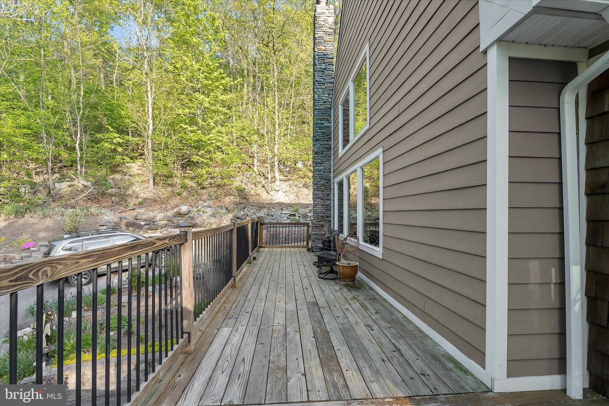 4623 Fishers Hollow Road Myersville, MD 21773 - Photo 60 of 65 a view of a balcony with wooden floor and fence