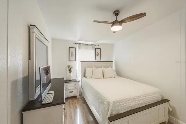 a large white bed in a white room