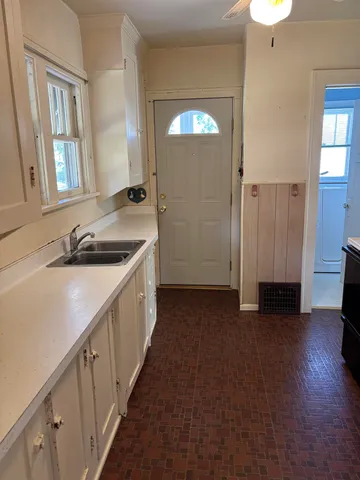 a bathroom with a bathtub and a window