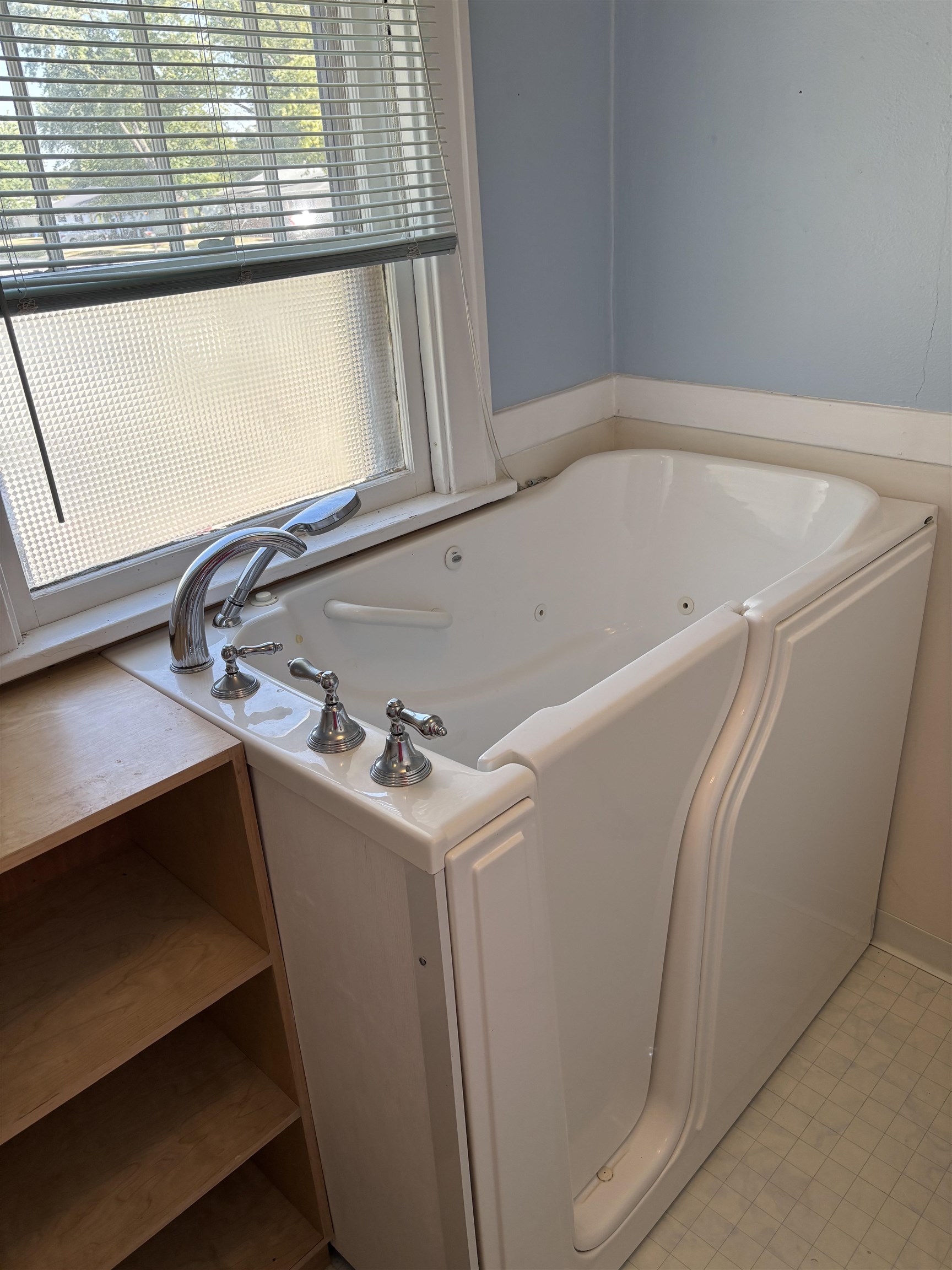 871 Cranston Road Beloit, WI 53511 - Photo 9 of 17 a bathroom with a bathtub and a window