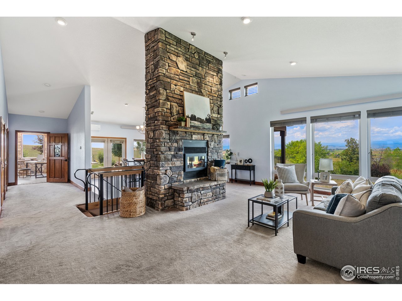 17622 County Road 1 Berthoud, CO 80513 - Photo 18 of 40 a living room with fireplace furniture and a large window
