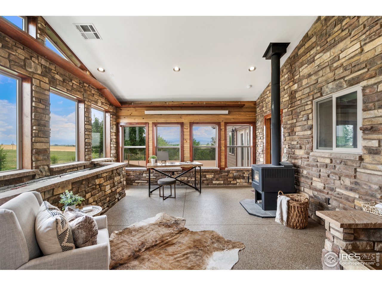 17622 County Road 1 Berthoud, CO 80513 - Photo 21 of 40 a living room with furniture and large windows