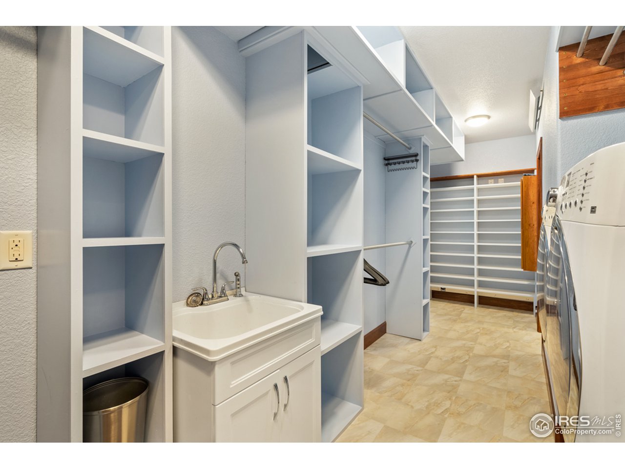 17622 County Road 1 Berthoud, CO 80513 - Photo 31 of 40 a kitchen with a sink and a refrigerator