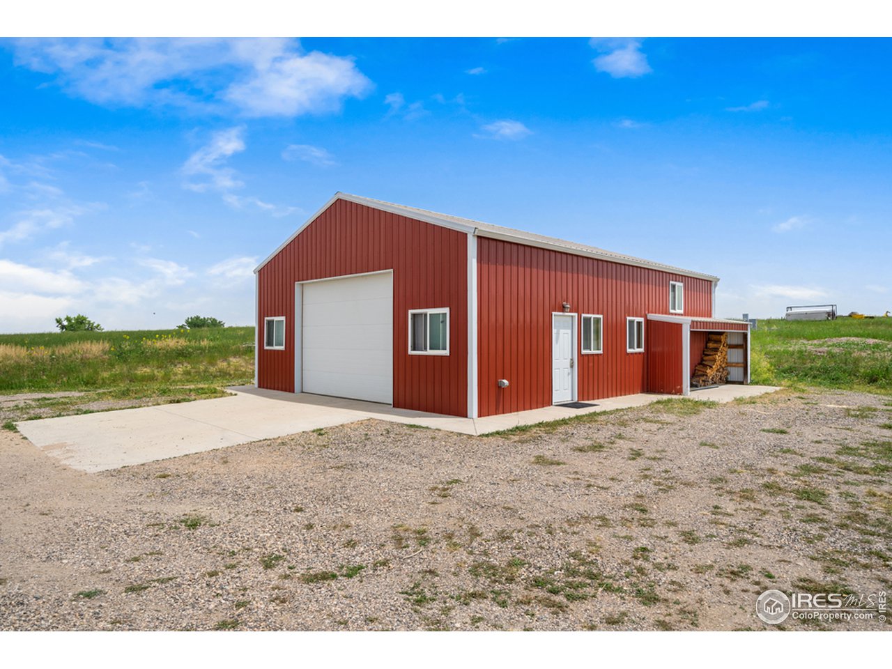 17622 County Road 1 Berthoud, CO 80513 - Photo 36 of 40 a front view of a house with a yard