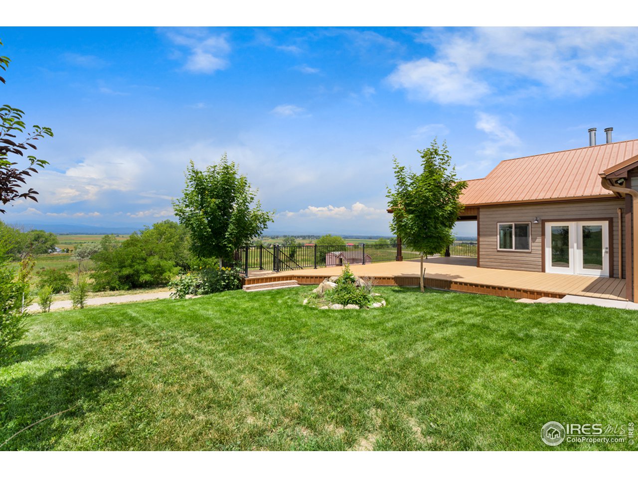 17622 County Road 1 Berthoud, CO 80513 - Photo 7 of 40 a view of a house with a yard porch and sitting area