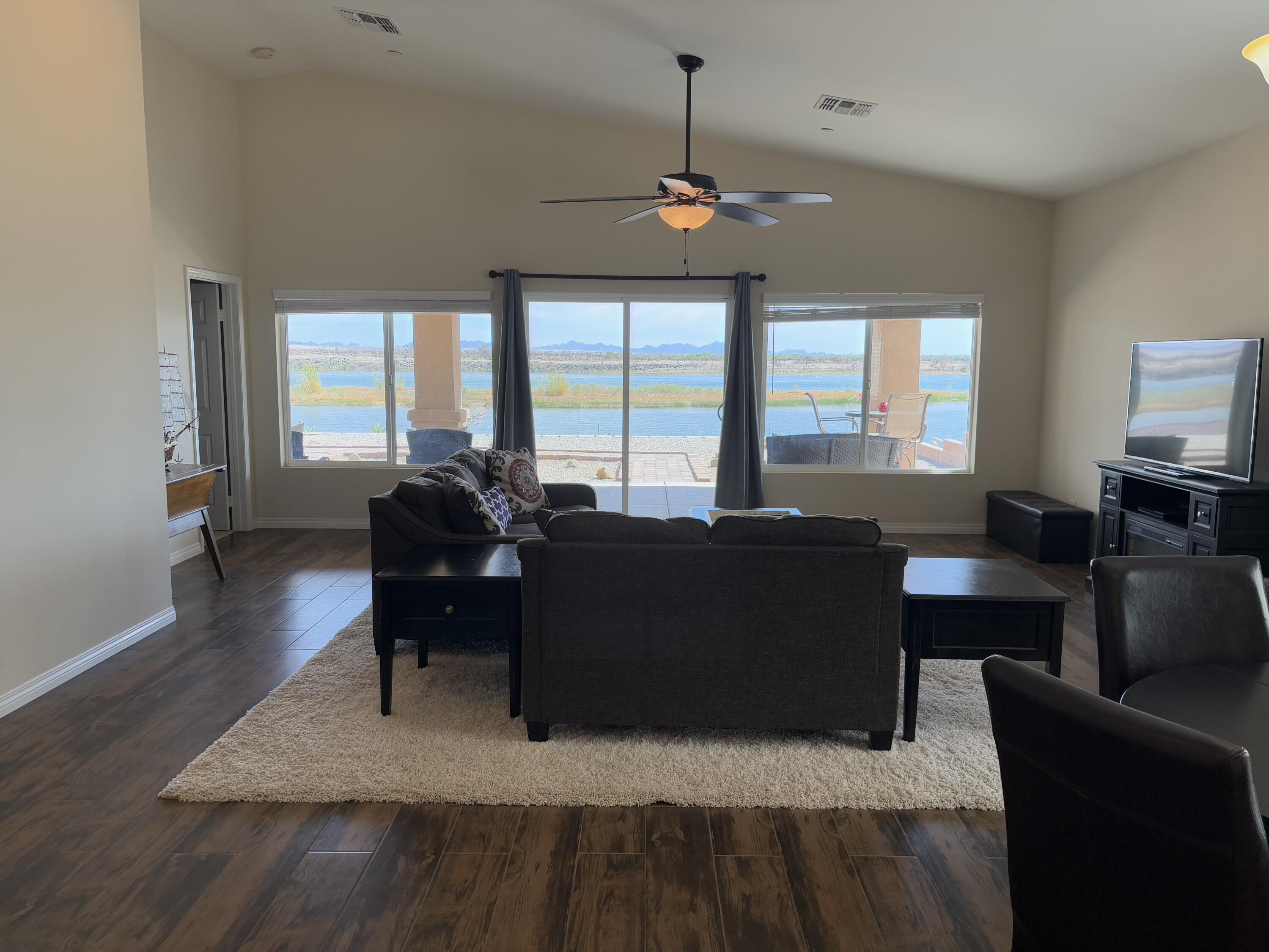 2674 Colorado River Road Blythe, CA 92225 - Photo 16 of 73 a living room with furniture and a flat screen tv