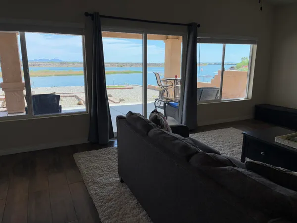 a living room with furniture and next to a window