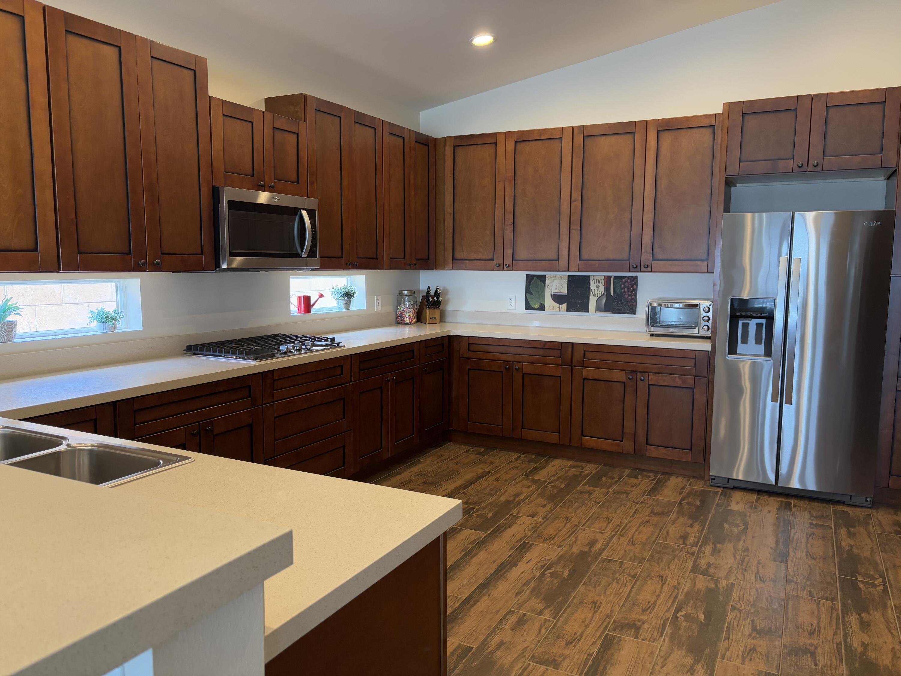 2674 Colorado River Road Blythe, CA 92225 - Photo 23 of 73 a kitchen with stainless steel appliances a sink a stove a refrigerator cabinets and a counter top space
