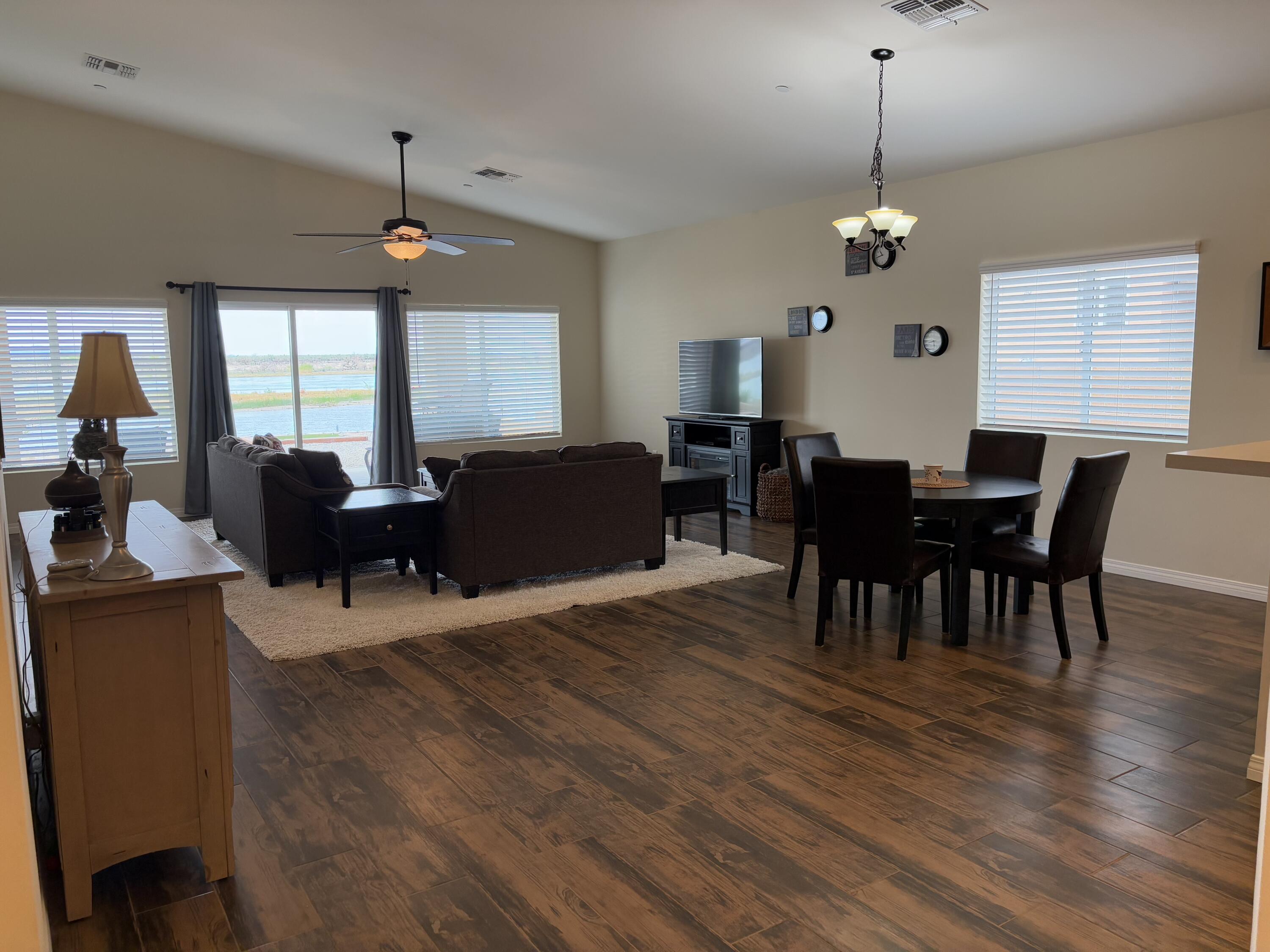 2674 Colorado River Road Blythe, CA 92225 - Photo 31 of 73 a view of a dining room with furniture window and wooden floor