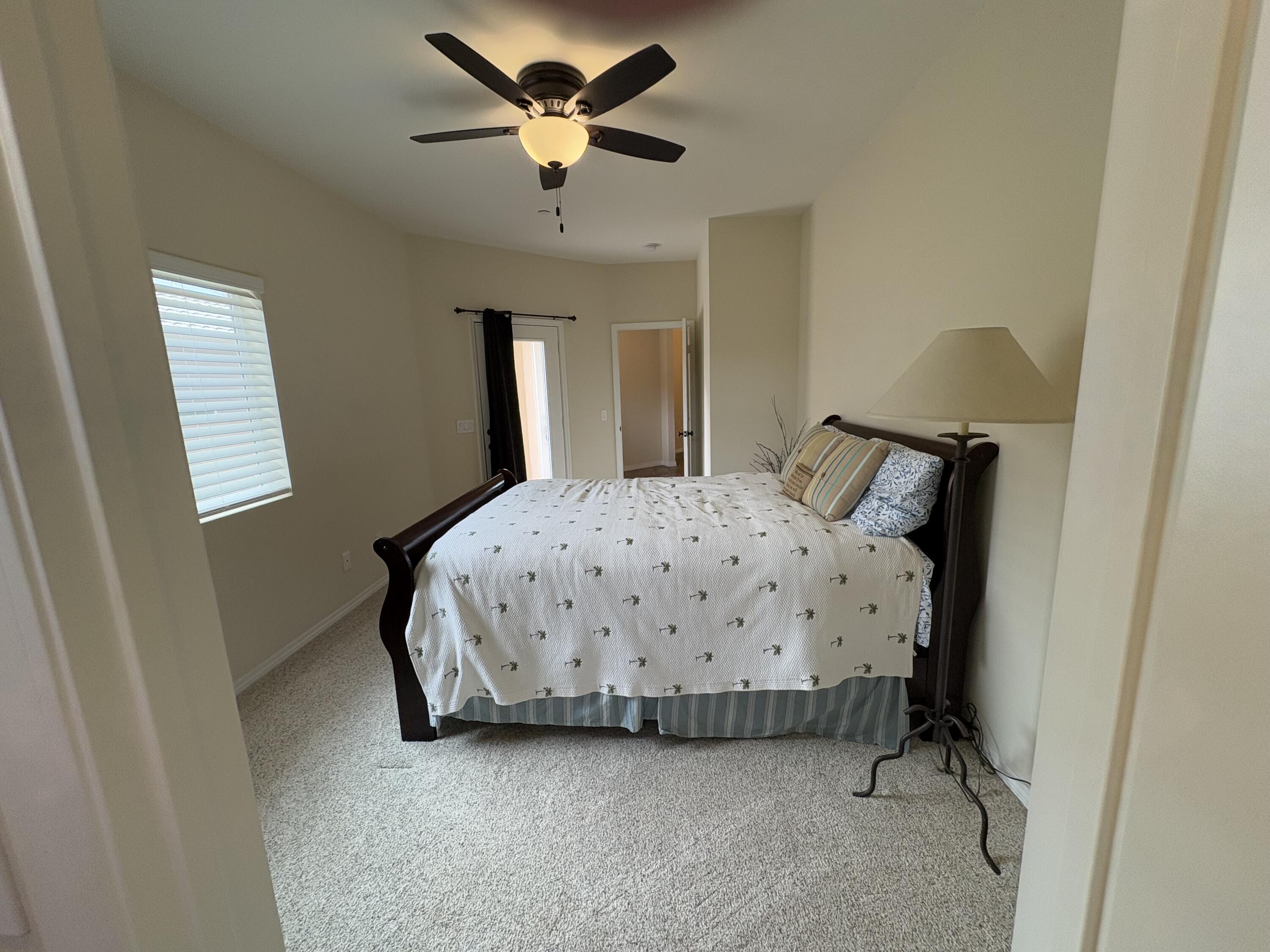 2674 Colorado River Road Blythe, CA 92225 - Photo 40 of 73 a bedroom with a bed and a chandelier